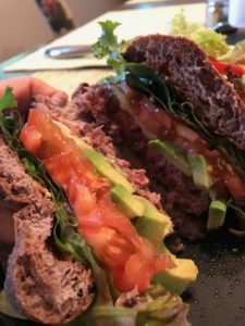 Grain-free hamburger bun loaded with lots of tasty goodies